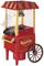A red, nostalgically designed popcorn cart with golden details and a chimney; mounted on two wheels with handles on the side.