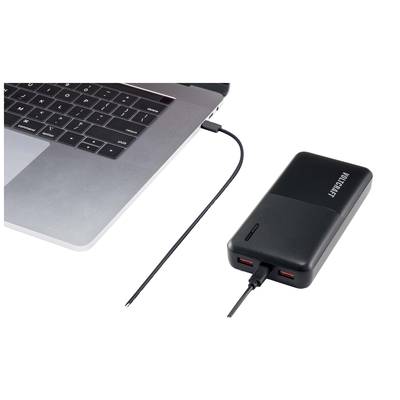 A laptop is connected to a power bank via a USB cable.