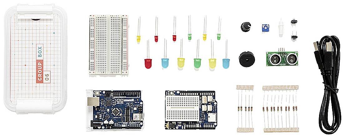 An Arduino starter kit with an Arduino board, breadboard, cables, LEDs, resistors, and sensors for electronics projects.