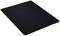 Black mousemat with green border, rectangular and flat.