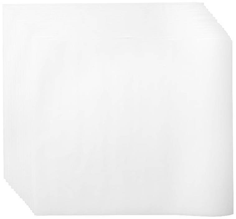 A stack of white square napkins.