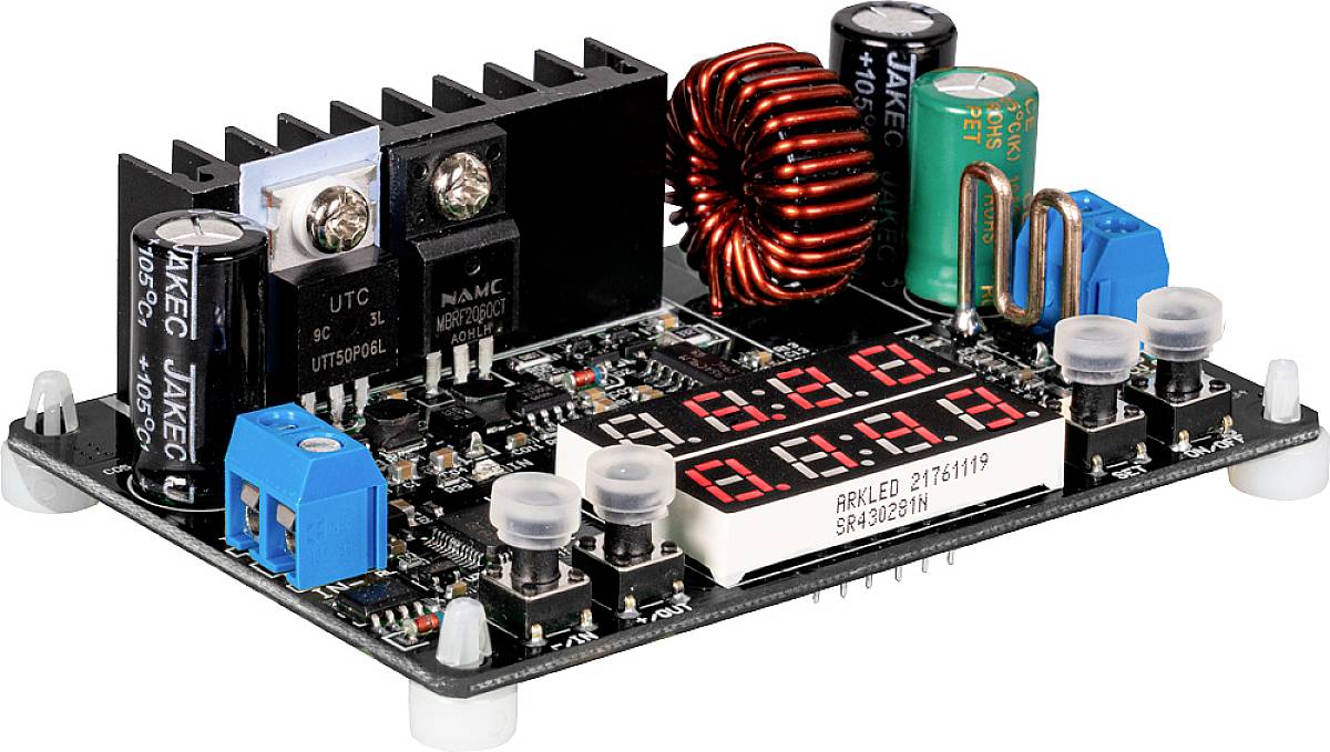 Electronic circuit with digital display, coils, capacitors and potentiometers on a circuit board, used for voltage regulation.