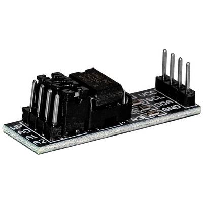 'Close-up of an electronic circuit board with a multi-pole component and several vertical pins on a black PCB.'