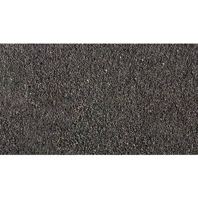 A close-up of black sand, evenly distributed. Texture and colour are the main features of the image, without any visible objects.