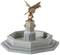 Figure of a winged warrior with shield and sword on an octagonal fountain adorned with animal heads.