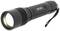 Black torch with ribbed grip and on/off switch, lying down and ready for use, with hand strap at the end of the handle.