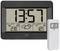 Electronic Weather Station with Large Digital Display: Time 13:57, Indoor Temperature 23°C, Outdoor Temperature 12°C, Weather Forecast Symbol.