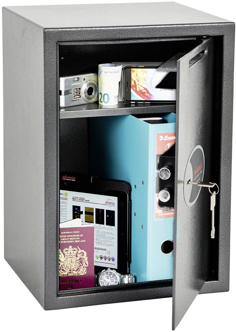 An open safe containing a camera, cash, folders, passport, wristwatch and keys.