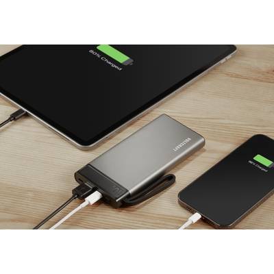 Tablet and smartphone on a wooden table, connected to a power bank, both displays showing '80% charged'.