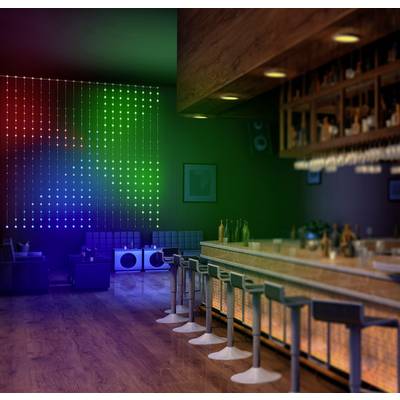 A stylish bar with contemporary chairs, an illuminated bar counter and a colourful LED wall in the background; cosy atmosphere.