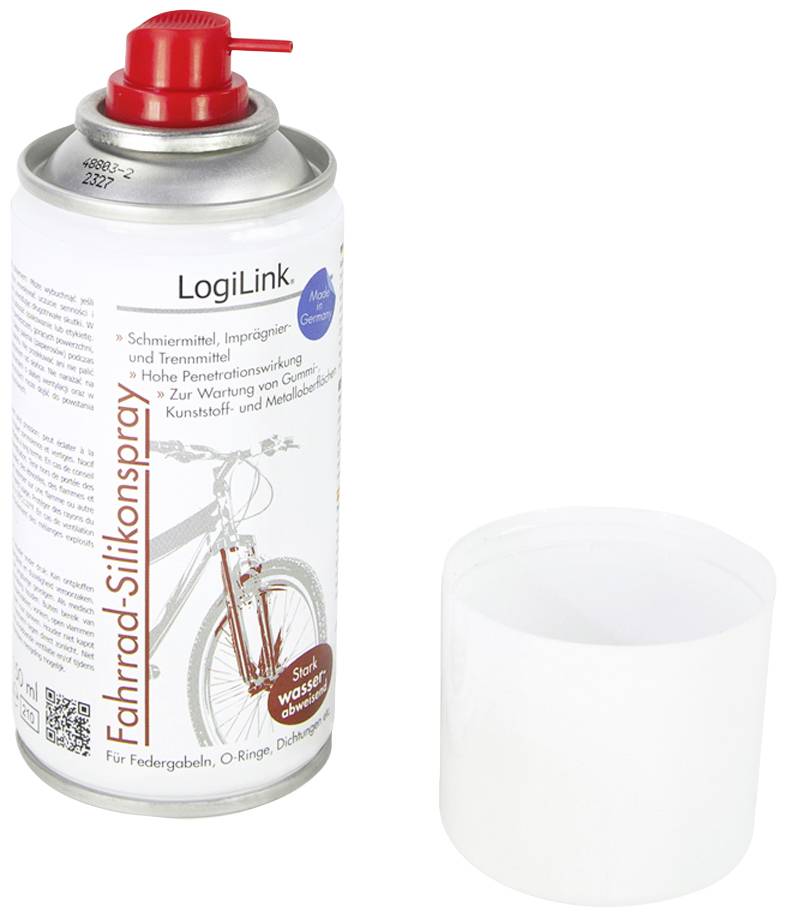 'Spray can with red lid. Labelled as bicycle silicone spray for care and maintenance. Adjacent transparent lid.'