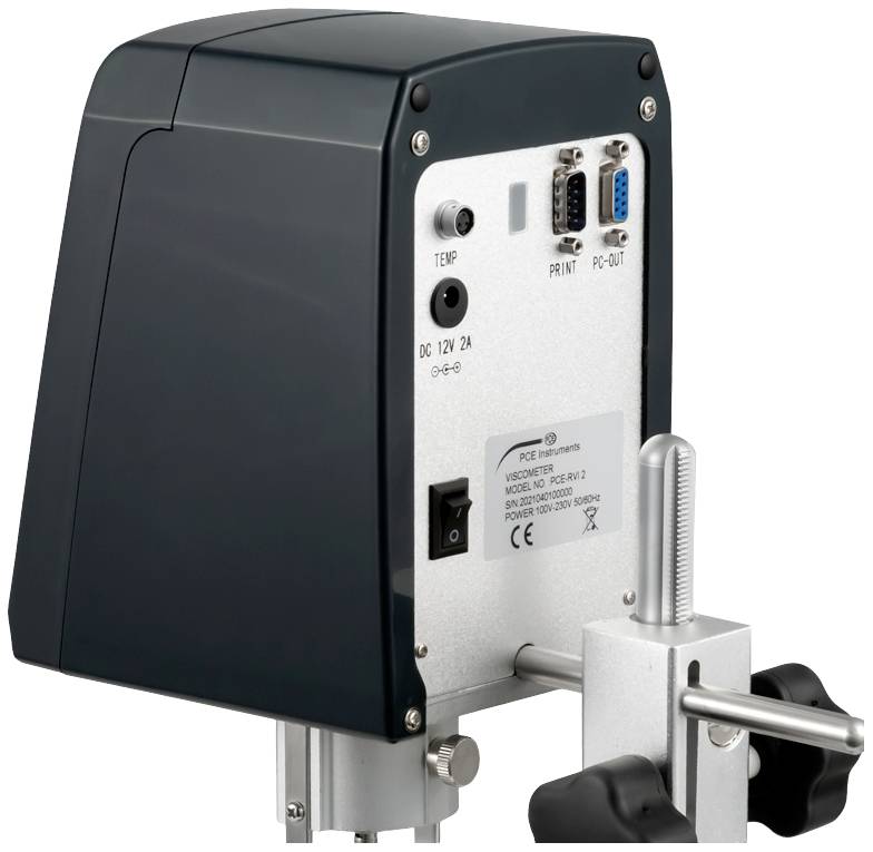 Electronic device in a dark enclosure with ports and controls on the rear, mounted on a metal stand.