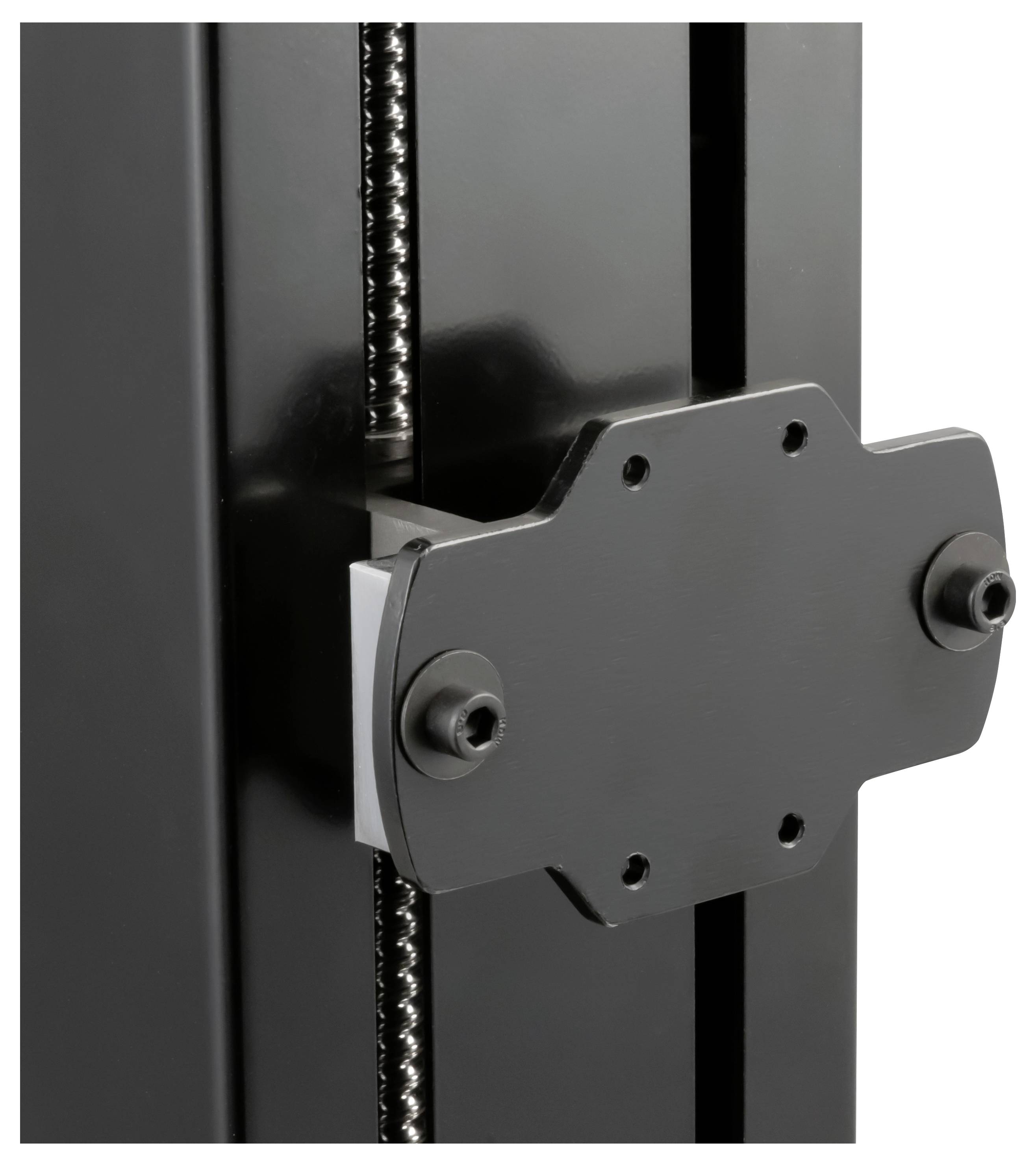 Close-up of a 3D printer’s extruder carriage mounted on a metal rail with a lead screw.
