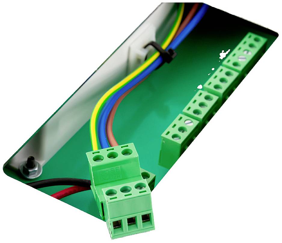 A green electrical cable connection panel with multiple coloured cables is partially connected with a green plug.
