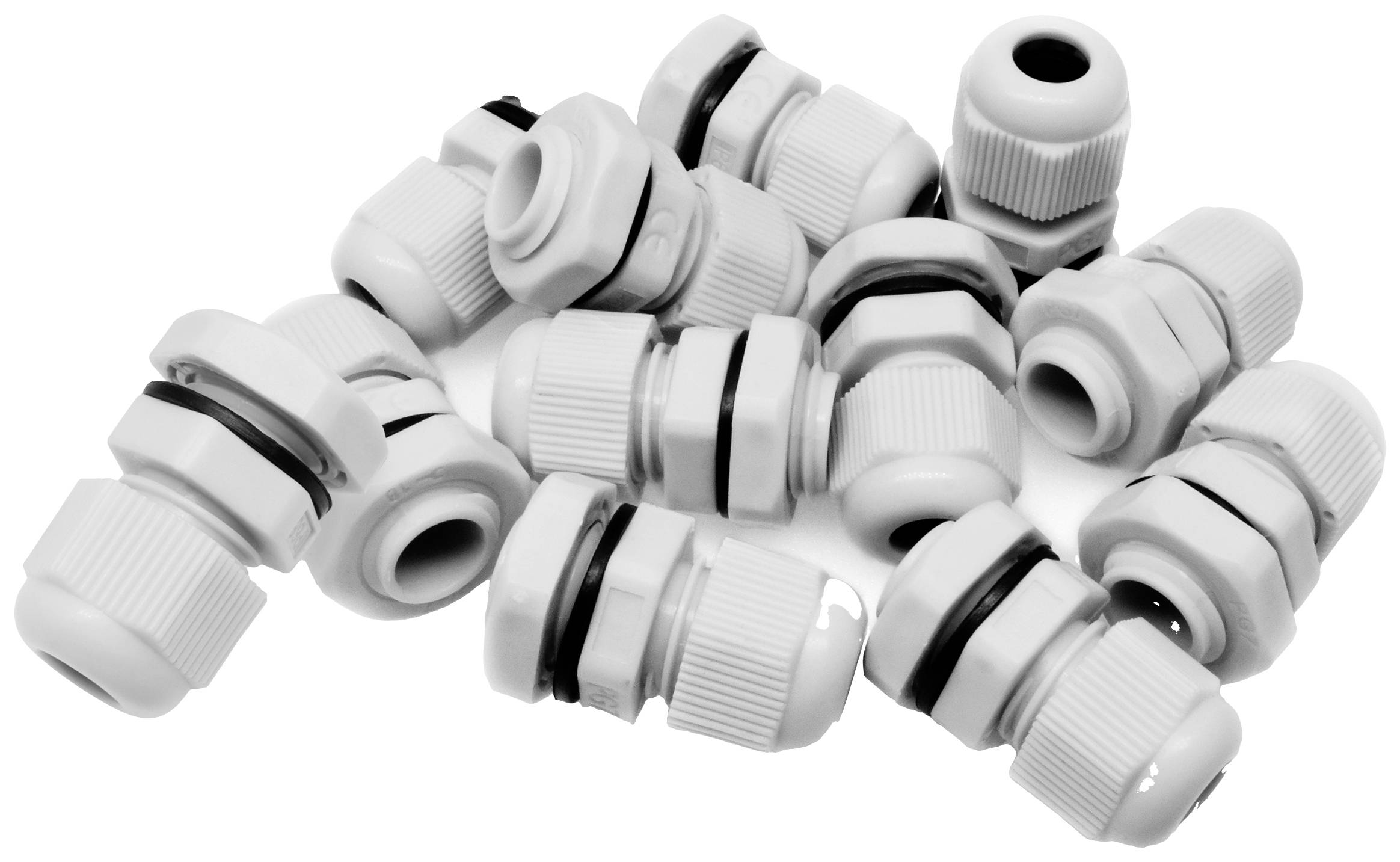 Several white cable glands in a pile, used for securely and tightly connecting cables in enclosures or devices.