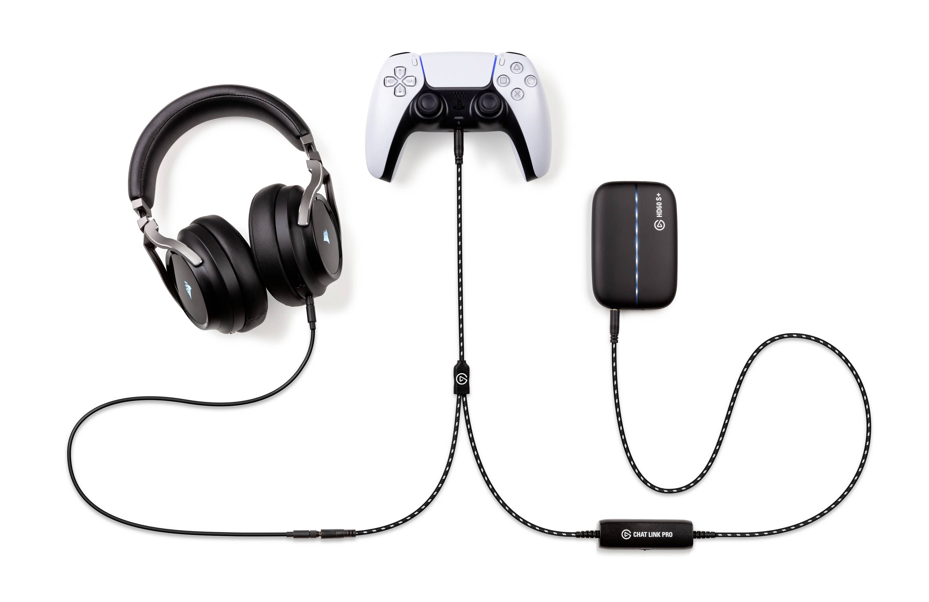 Headset, game controller and adapter with connecting cables on a white background. The controller is centrally positioned and surrounded by accessories.