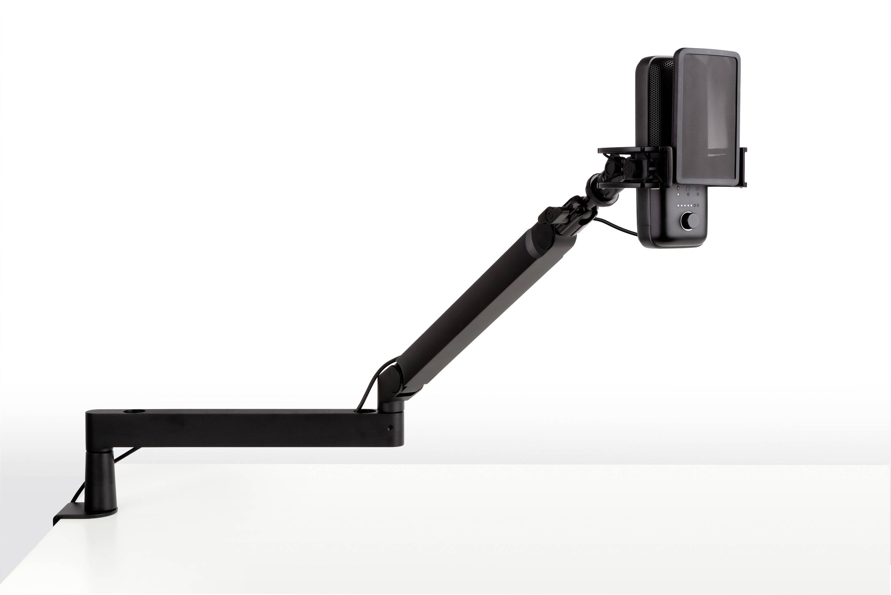 A black, adjustable monitor arm mounted on a desk, holding a device. Suitable for adjusting the monitor position.
