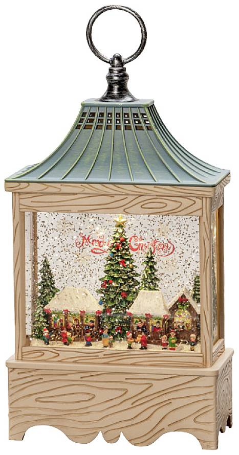 Lantern with Christmas scene: Snowfall over village with houses, decorated with lights. Sign says 'Merry Christmas'.