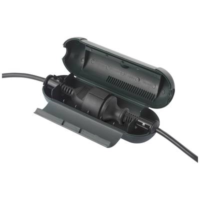A green junction box protects a cable connection outdoors, securing the connection against moisture and weather conditions.