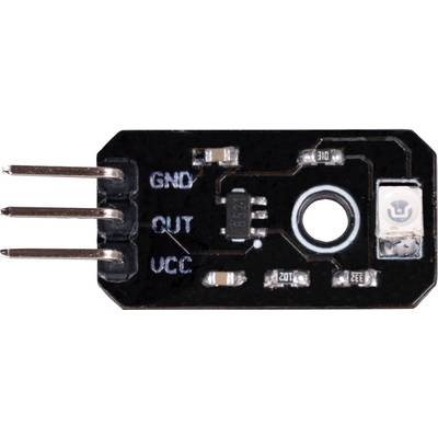 A black moisture sensor with three pins labelled as 'GND', 'OUT', 'VCC'. A microchip is positioned in the centre.