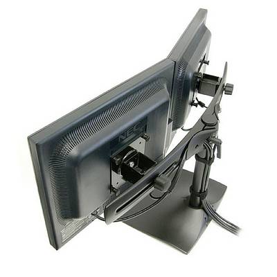 Two side-by-side mounted computer monitors on an adjustable stand, viewed from behind, showing cable management.