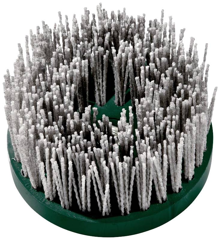 Cleaning brush with long, dense bristles on a green, circular base. Used for surface cleaning or material removal.