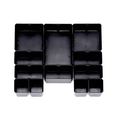 Black plastic plant pots in various sizes, arranged in a rectangular pattern.
