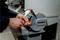 A person is grinding a tool with a Metabo grinding device. Sparks are flying from the grinding point.