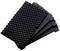 Black, pyramid-shaped acoustic foam stacked, used for sound absorption.