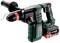A green and black cordless hammer drill with a red handle and controls, suitable for heavy-duty drilling work. Brand name 'Metabo'.