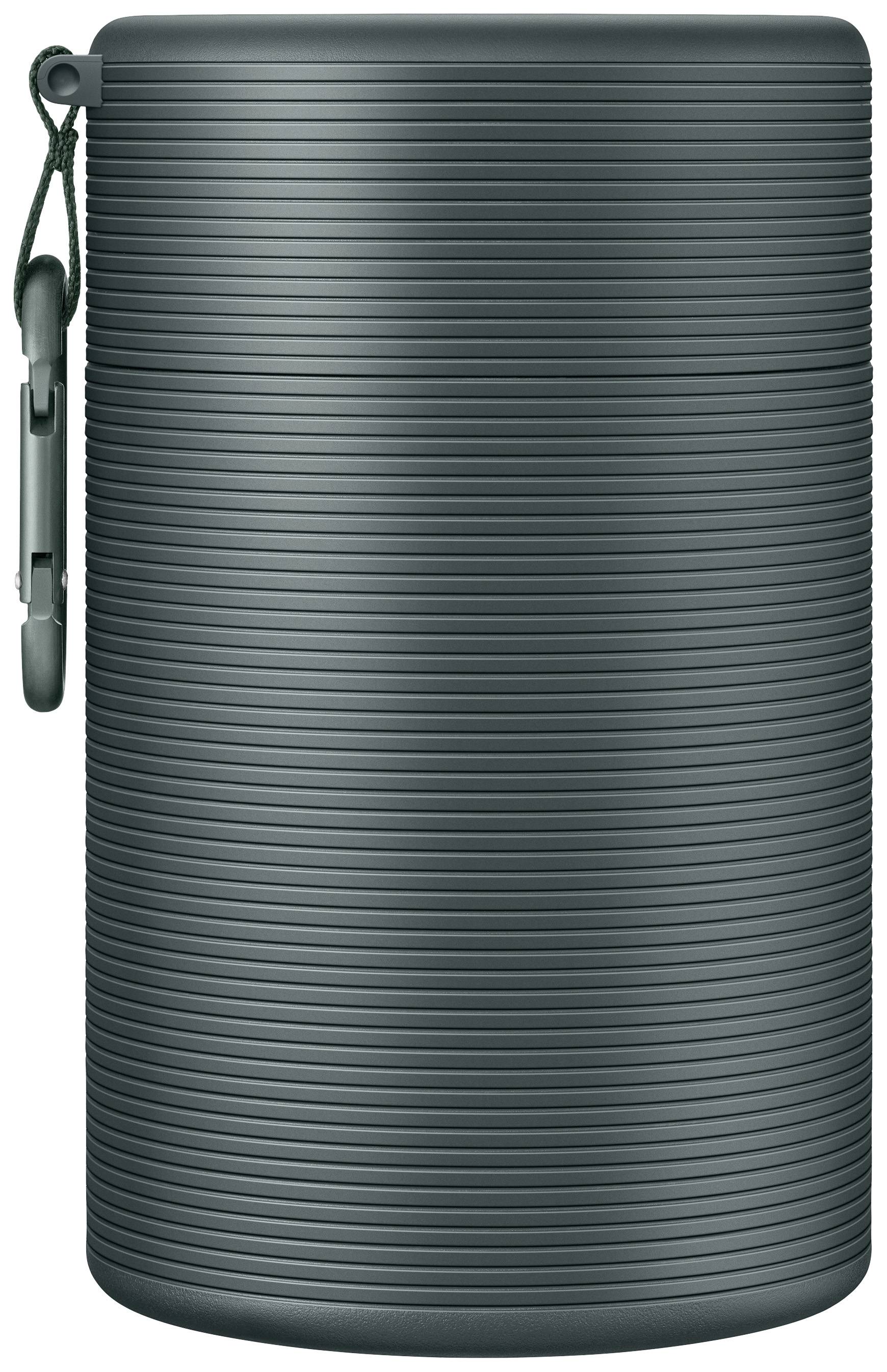 Wireless, cylindrical speaker with a ribbed design and carry loop, suitable for mobile use and outdoor activities.