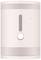 A rectangular, pink device with perforated patterns at the top and bottom, a central switch, and a small LED indicator to its right.