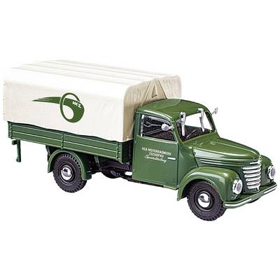 Green, old lorry with light canvas cover and lettering for "WZ Kraftfahrzeugwerke". Retro design, model vehicle style.