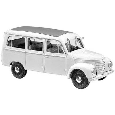 A model of a classic white minibus in a retro design with a rounded roof and five windows on the left side.