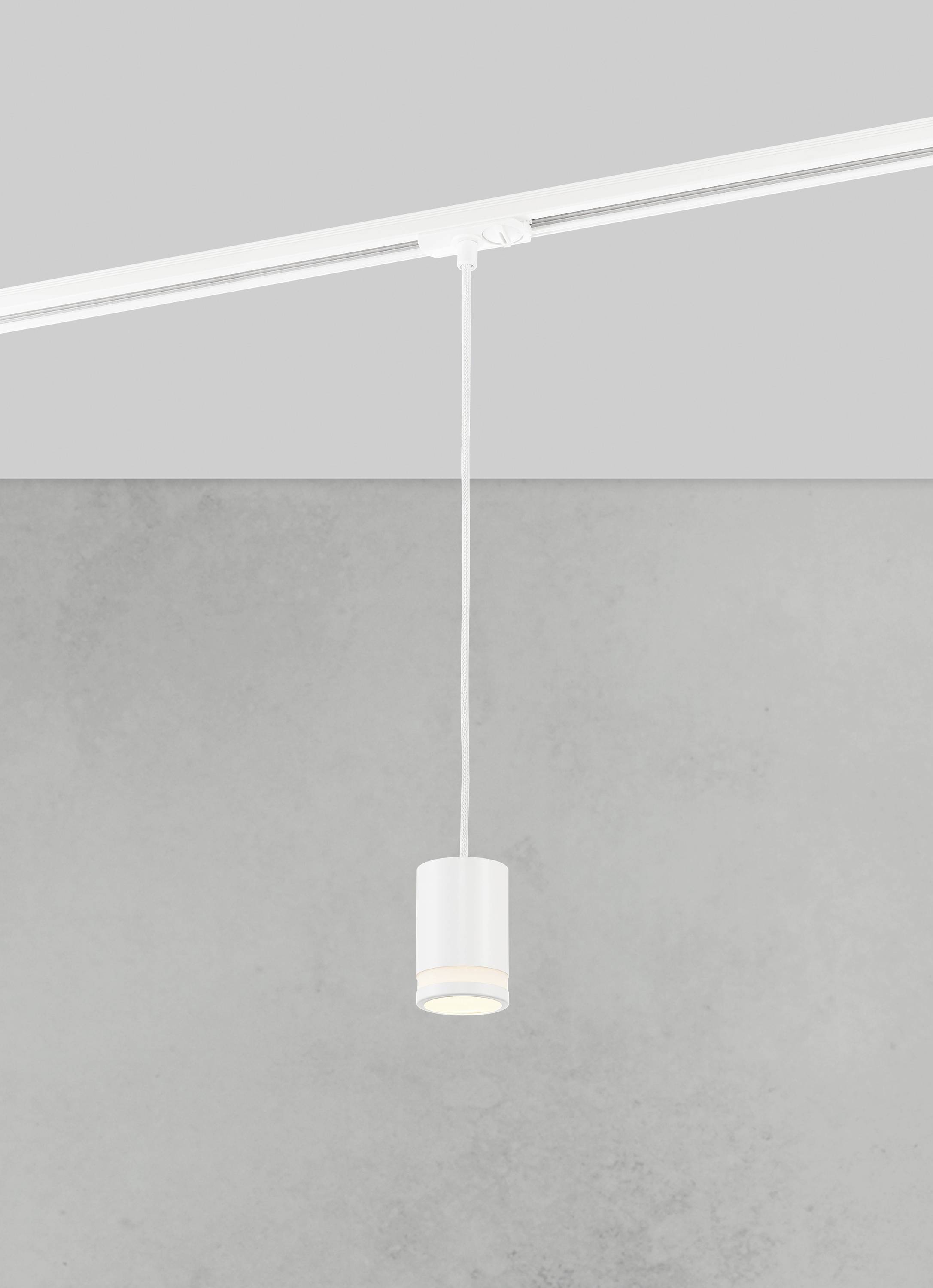 A single white pendant light hangs from a track in front of a grey wall. Simple, modern design.