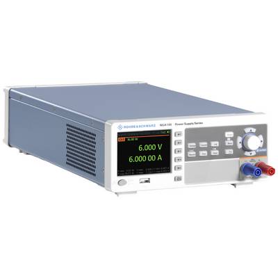 A laboratory power supply with a digital display is showing 6,000 V and 6,000 A. It has various control elements and connection sockets on the front panel.