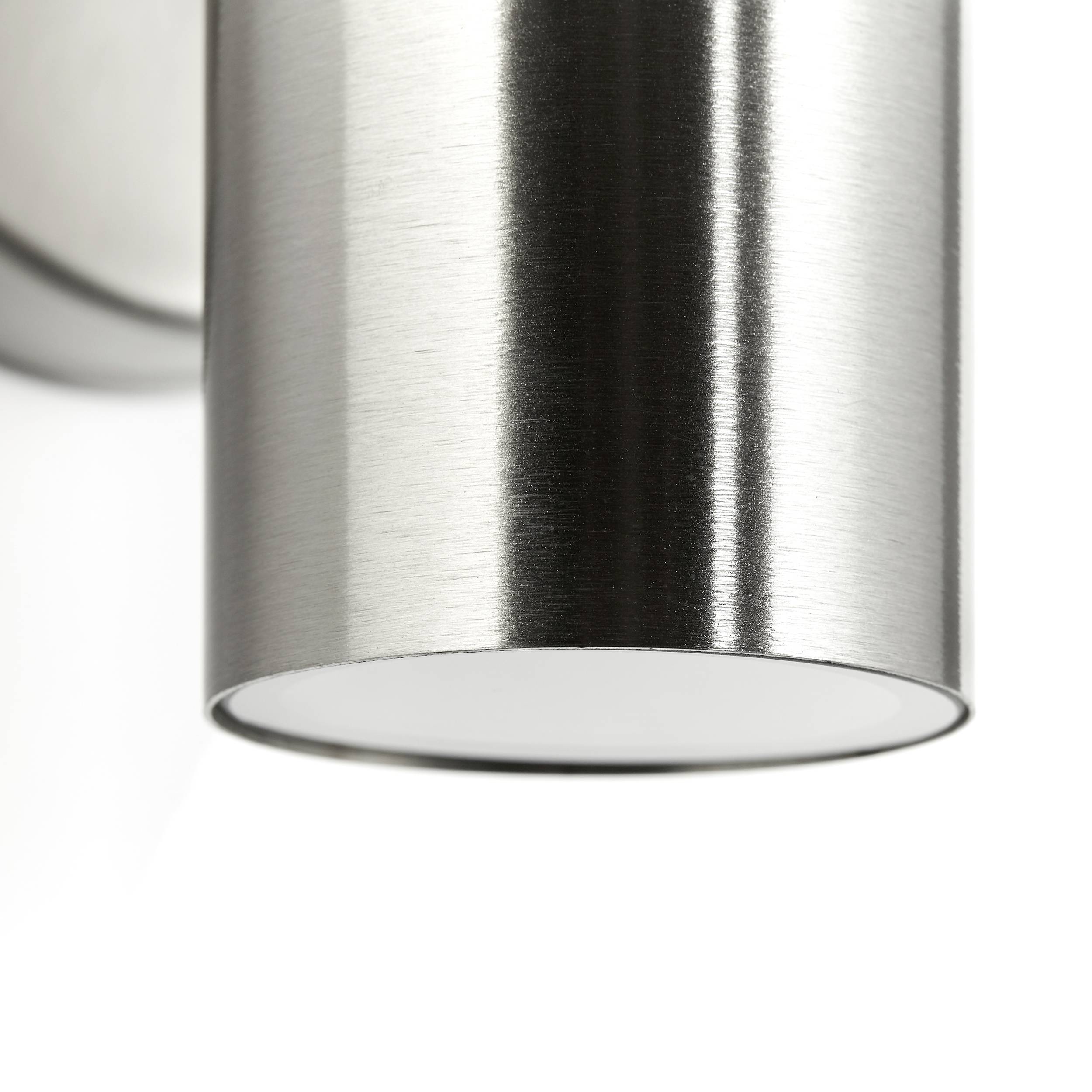 Silver, cylindrical metal light fitting with a smooth surface. Suitable for contemporary interior lighting.
