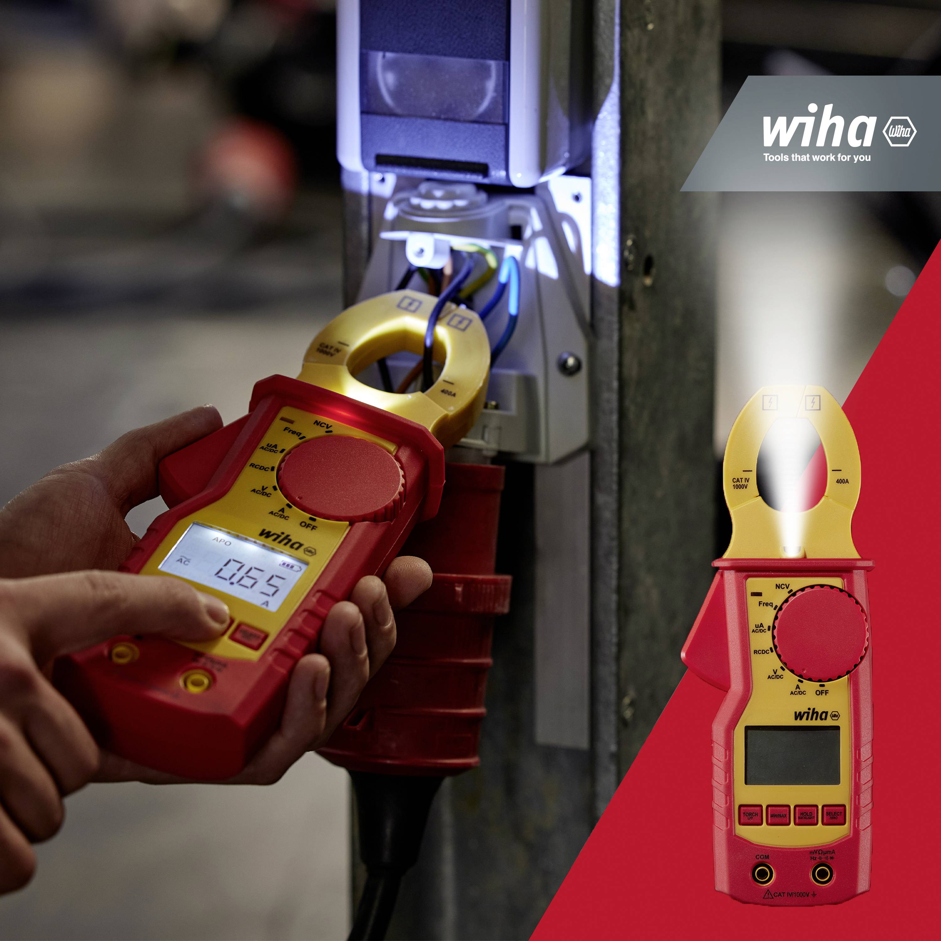 'A person is using a Wiha digital multimeter clamp for electrical measurement at a power source in an industrial environment.'