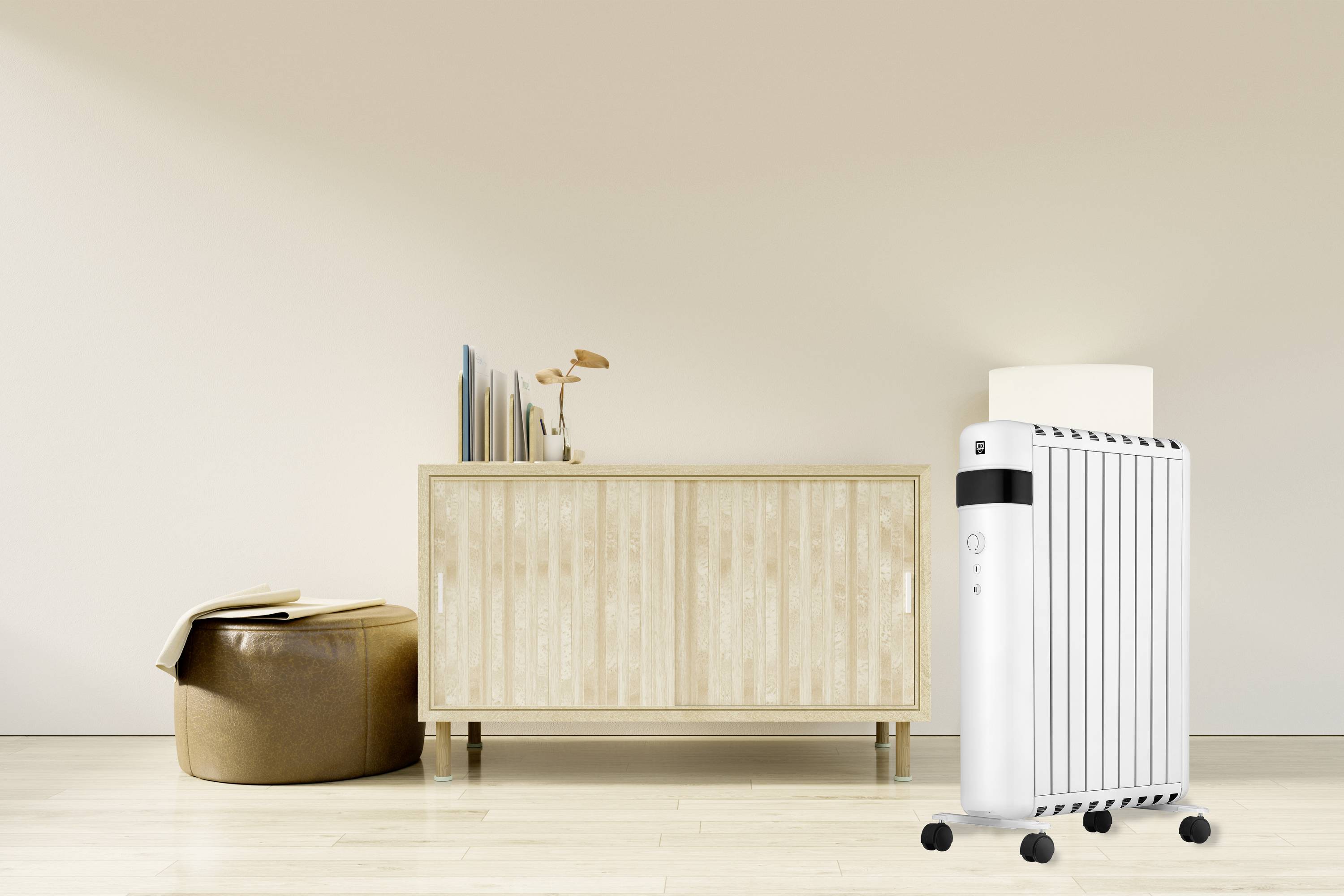 A white oil-filled radiator stands on a light wooden floor in front of a minimalist wooden cabinet with décor and a brown stool.