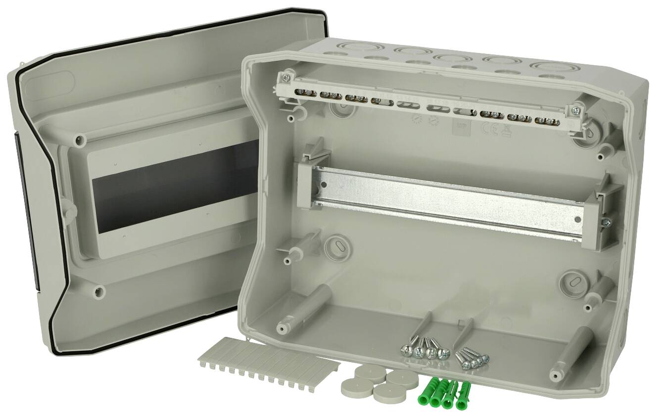 Opened grey enclosure with multiple connection options, screws, green wall plugs, and small covers; suitable for electrical installations.