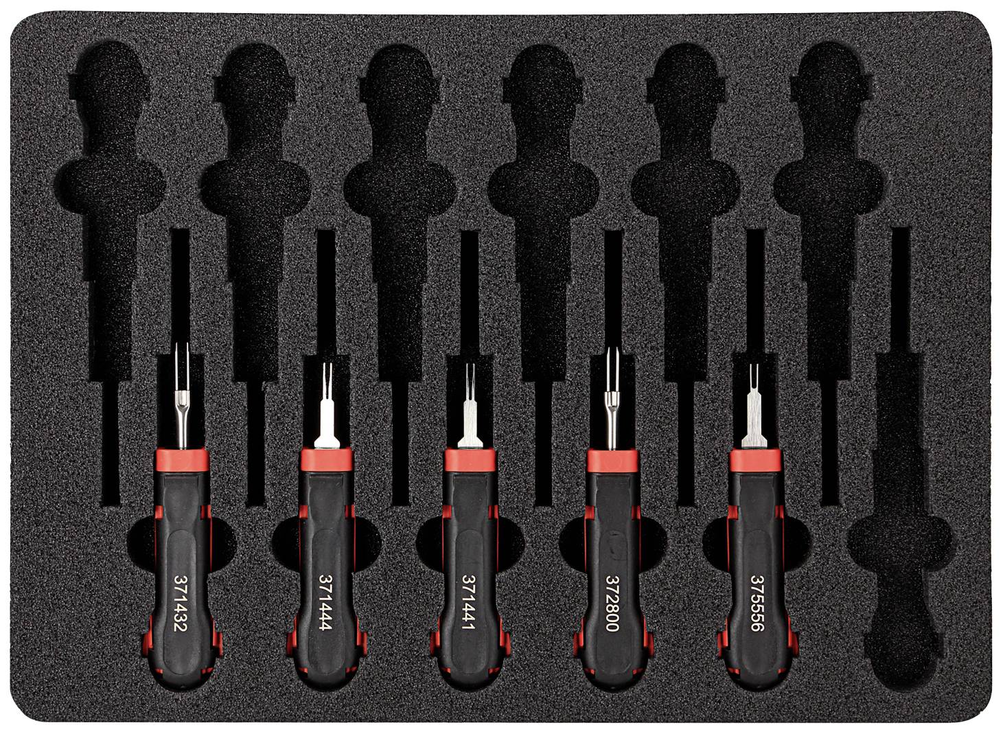 A set of five screwdrivers with black handles and red details in a foam insert, viewed from above.