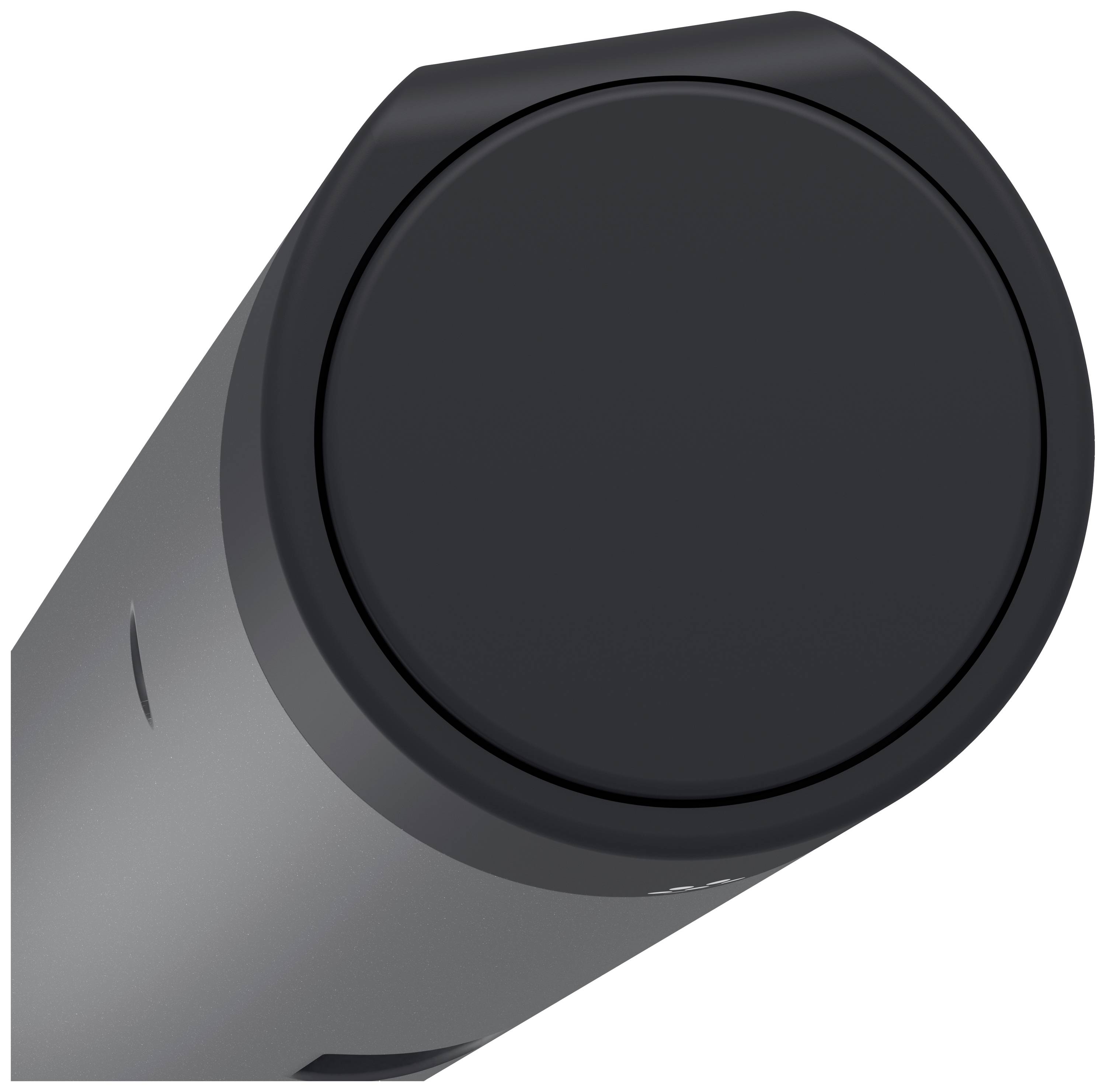 Black, round button on a grey device, possibly a speaker or technical equipment, from a close-up perspective.