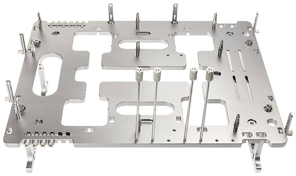 Metal plate with multiple openings and structures, likely part of a technical device or assembly.