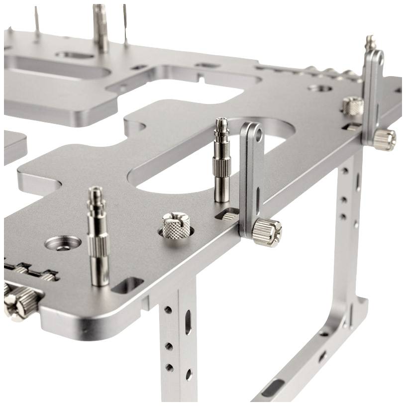 Metal mounting bracket with multiple screws and recesses, partially assembled on a white background.