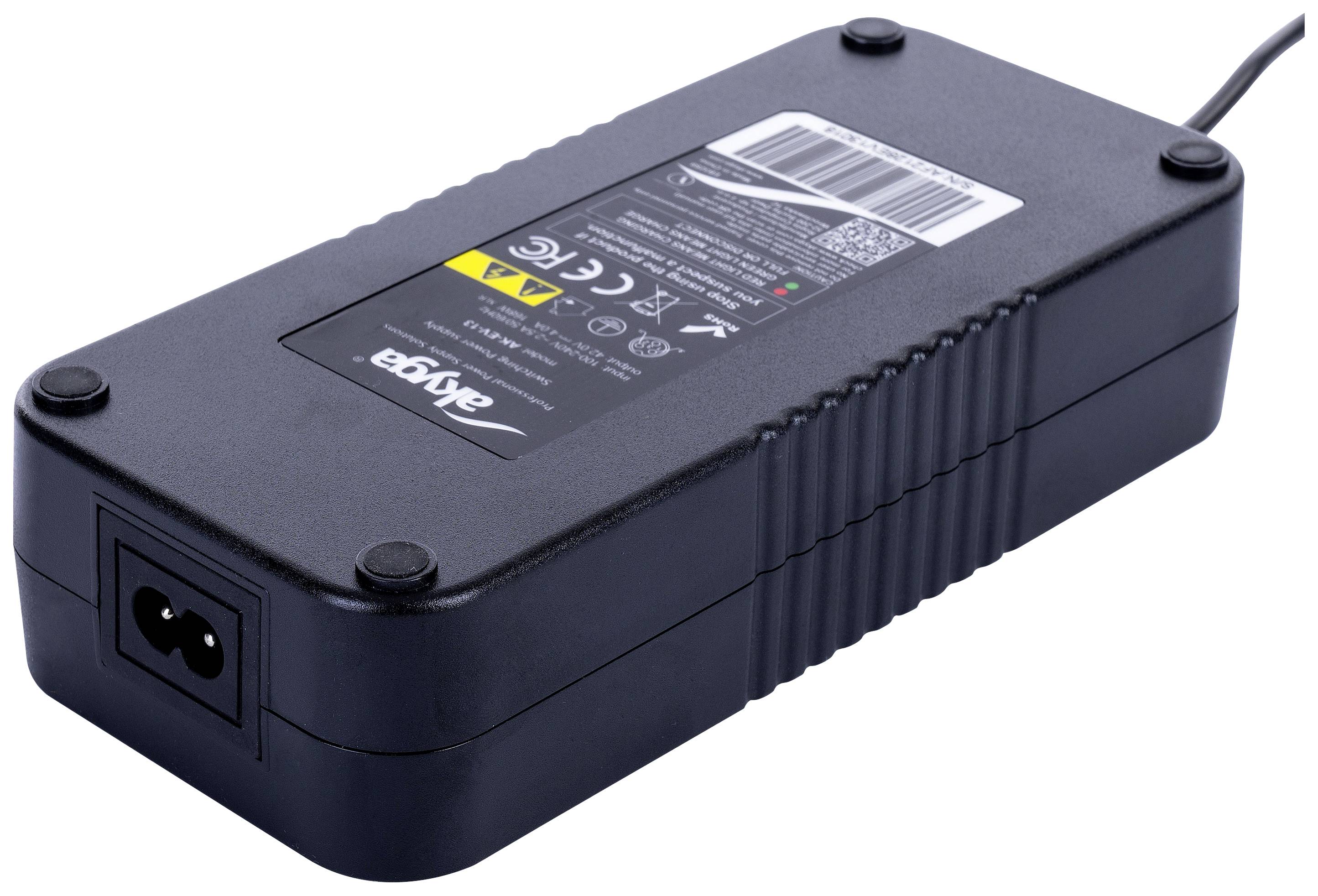 A black power supply with a technical label on the top surface; contains warning notices and type specifications.