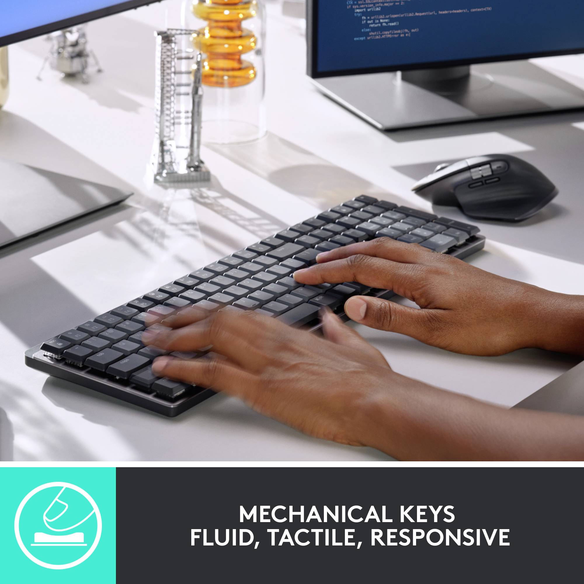 Keyboard on desk with hands typing. Monitor and mouse in the background. Caption emphasises responsiveness.