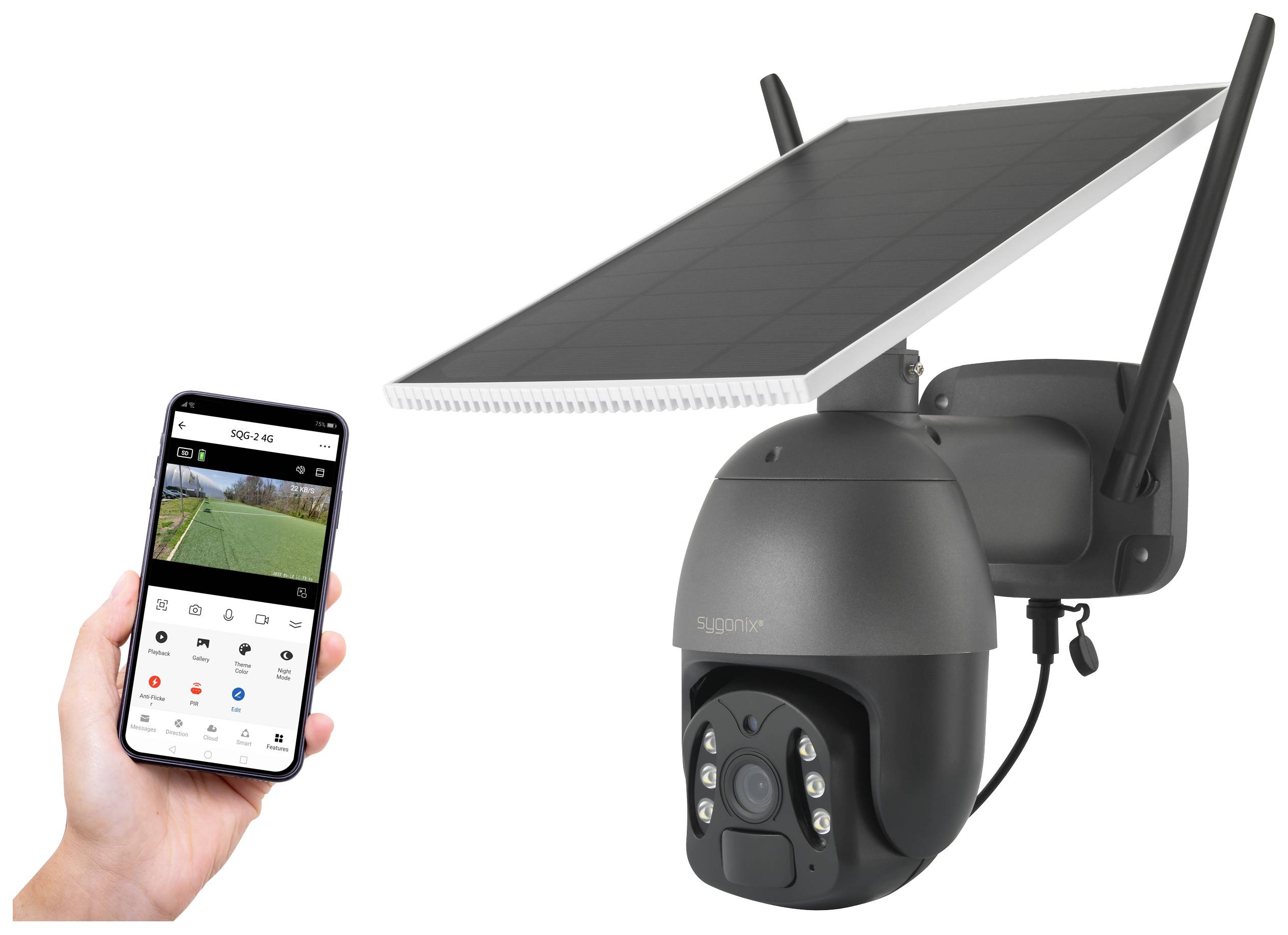 A surveillance camera with a solar panel and a mobile phone displaying the camera view.