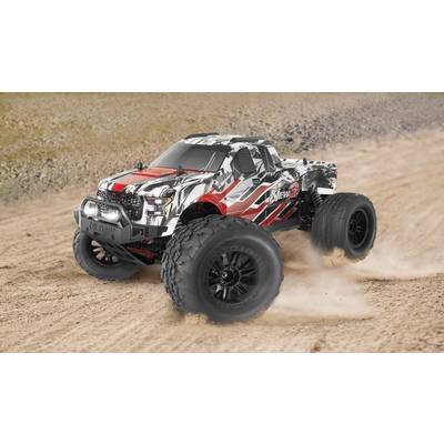 A remote-controlled car speeds along a dusty track. It has a modern, colourful design with large tyres.