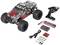 A remote-controlled car with accessories: remote control, charger, rechargeable batteries, and batteries. The car has a red and black camouflage design.