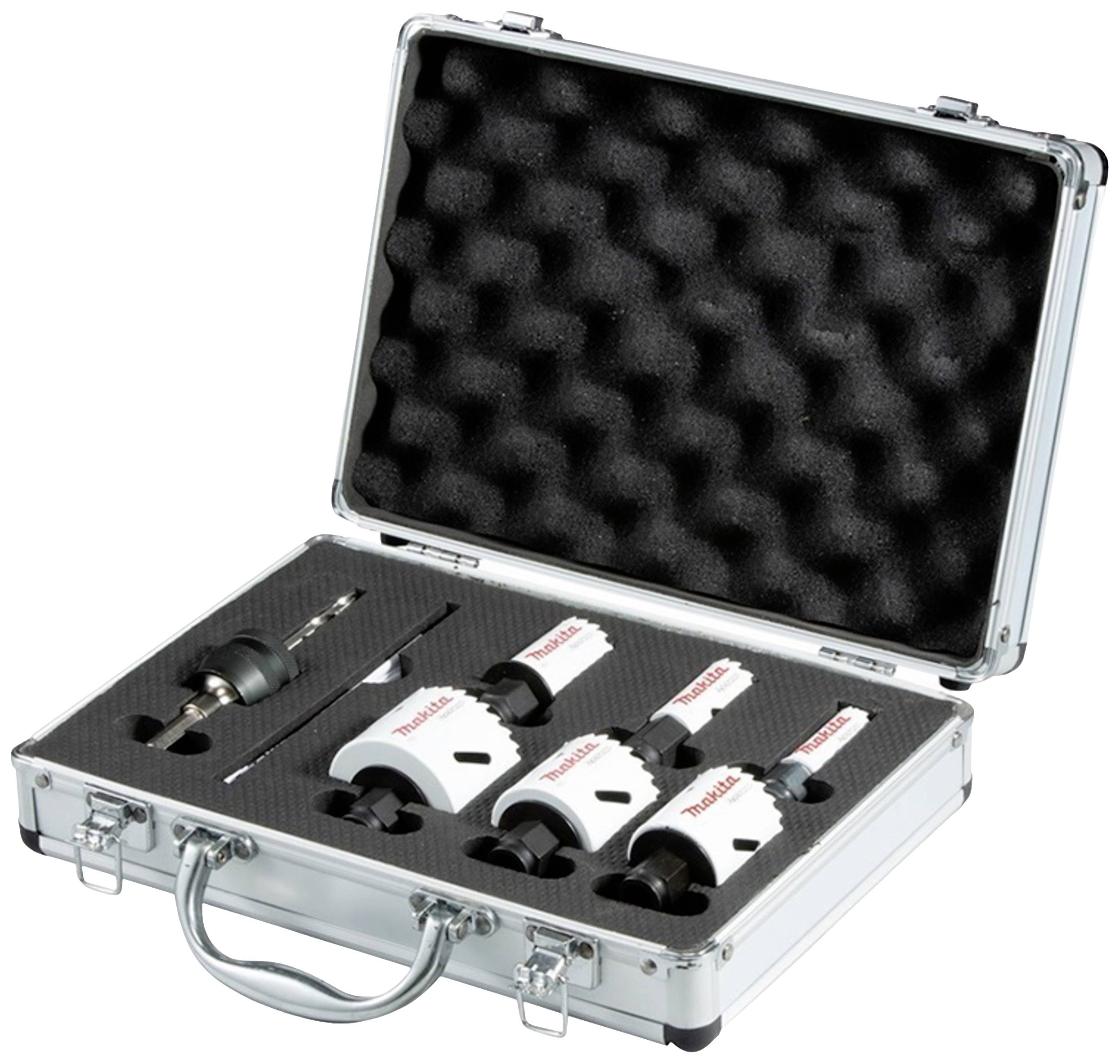 Case containing drill crowns and accessories. Contains multiple attachments and a drill. Foam insert organises the parts in the case.